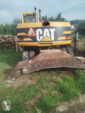 Graafmachine op banden Caterpillar