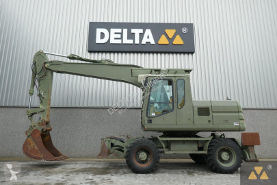 Graafmachine op banden Caterpillar