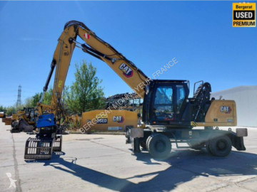 Graafmachine op banden Caterpillar