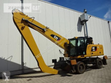 Caterpillar MH3024 pelle sur pneus occasion