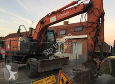 Hitachi ZX140W-3 használt gumiabroncsos kotrógép