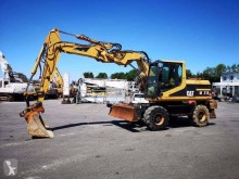 Caterpillar M315 2001 gravemaskine på hjul brugt