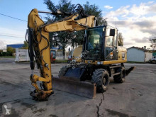 Caterpillar M313 koparka kołowa używana