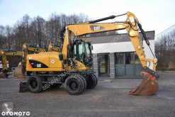 Caterpillar 313 D kolová lopata použitý