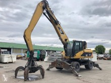 Caterpillar CAT M318D használt gumiabroncsos kotrógép
