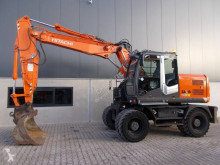 Hitachi ZX140W-3 tweedehands graafmachine op banden