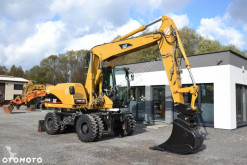 Caterpillar 313 C használt gumiabroncsos kotrógép