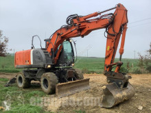 Hitachi ZX140W pelle sur pneus occasion