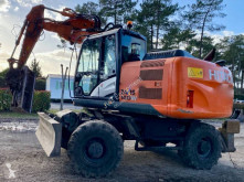 Hitachi ZX140W-3 pelle sur pneus occasion