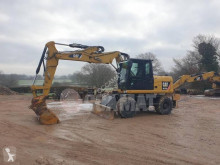 Caterpillar M313 M313D escavadora de rodas usada