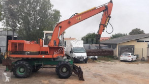 Pelle sur pneus Caterpillar 212BFT