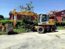 Liebherr A312 pelle sur pneus occasion
