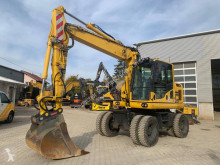 Komatsu PW148-10 mit Oil Quick pelle sur pneus occasion