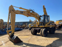 Caterpillar M315 gravemaskine på hjul brugt