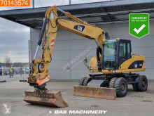 Caterpillar M316 gravemaskine på hjul brugt