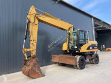 Caterpillar M316 экскаватор колёсный б/у