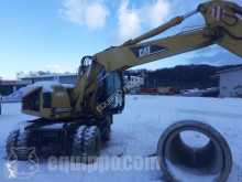 Caterpillar M313C экскаватор колёсный б/у