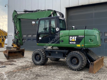 Caterpillar M315 tweedehands graafmachine op banden