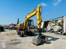 Caterpillar M312 tweedehands graafmachine op banden
