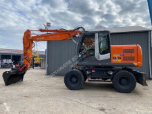 Pelle sur pneus Hitachi ZX 140 W T-3