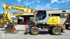 New Holland MH 5.6 használt gumiabroncsos kotrógép