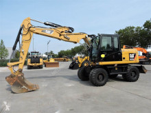 Caterpillar M313D tweedehands graafmachine op banden