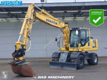 Komatsu PW160 tweedehands graafmachine op banden