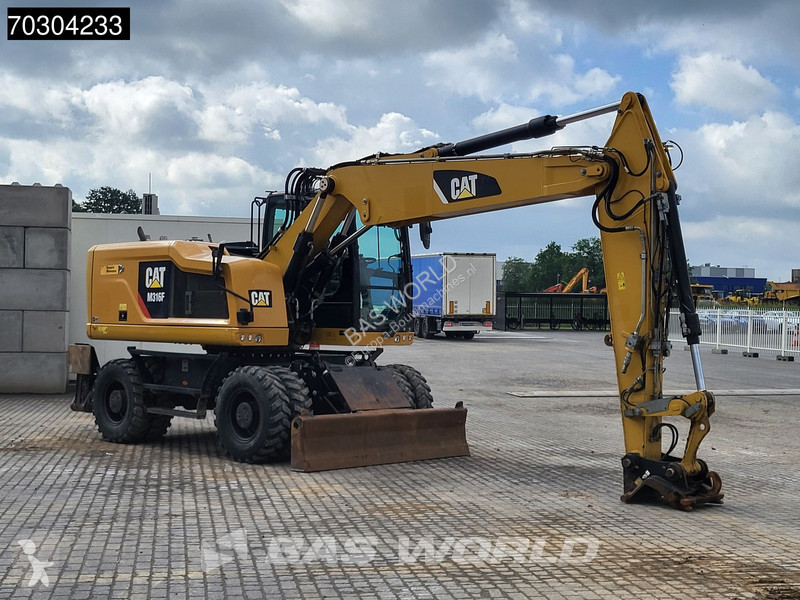 جرافة Caterpillar F F Outrigger + Blade