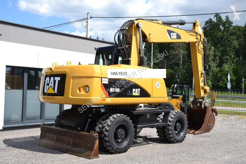 Lopatový nakládač Caterpillar 318 D