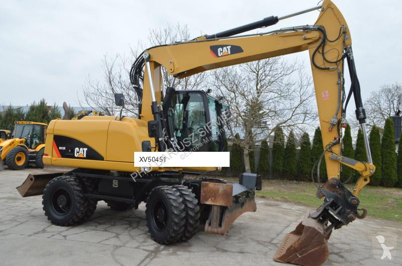 Lopatový nakládač Caterpillar 313