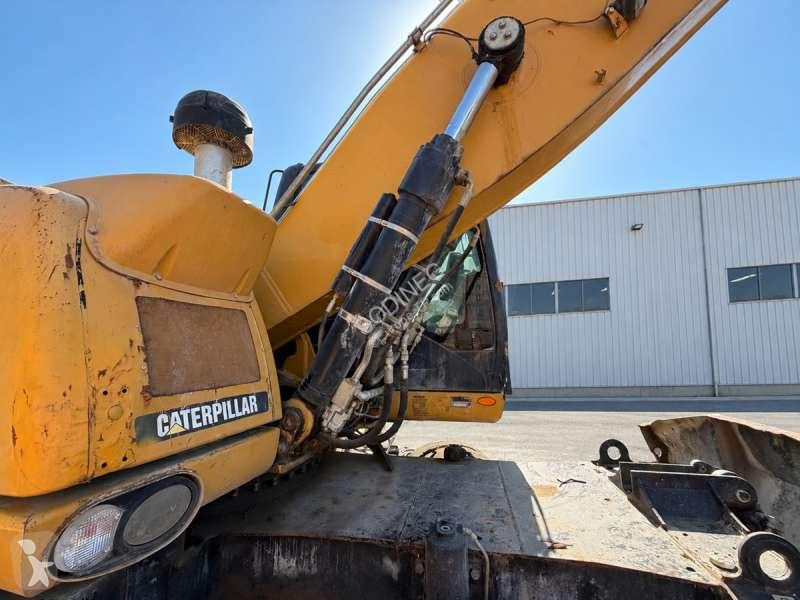 Багер Caterpillar MH