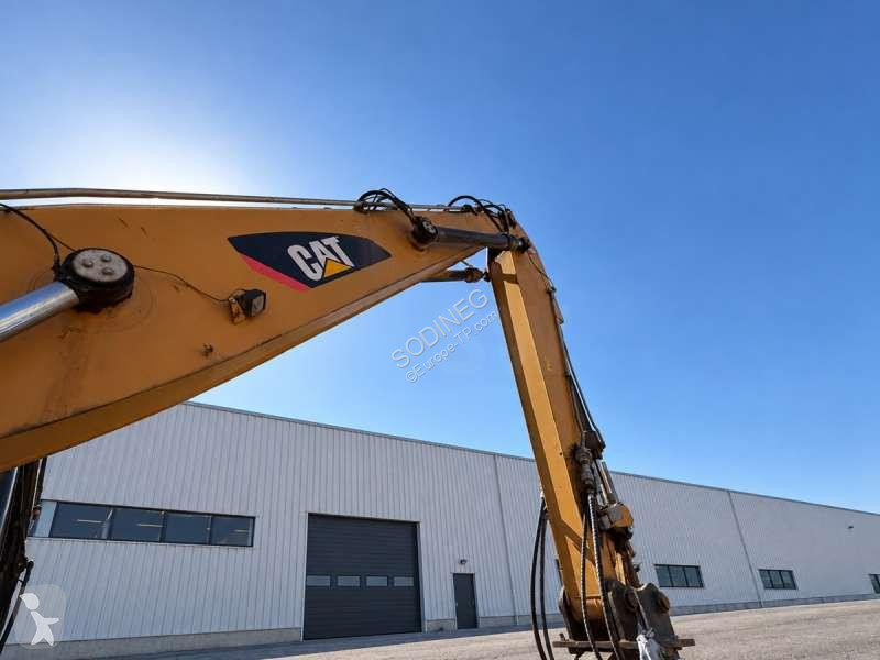 Багер Caterpillar MH