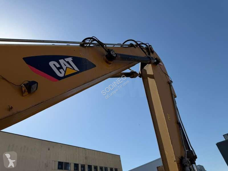 Багер Caterpillar MH