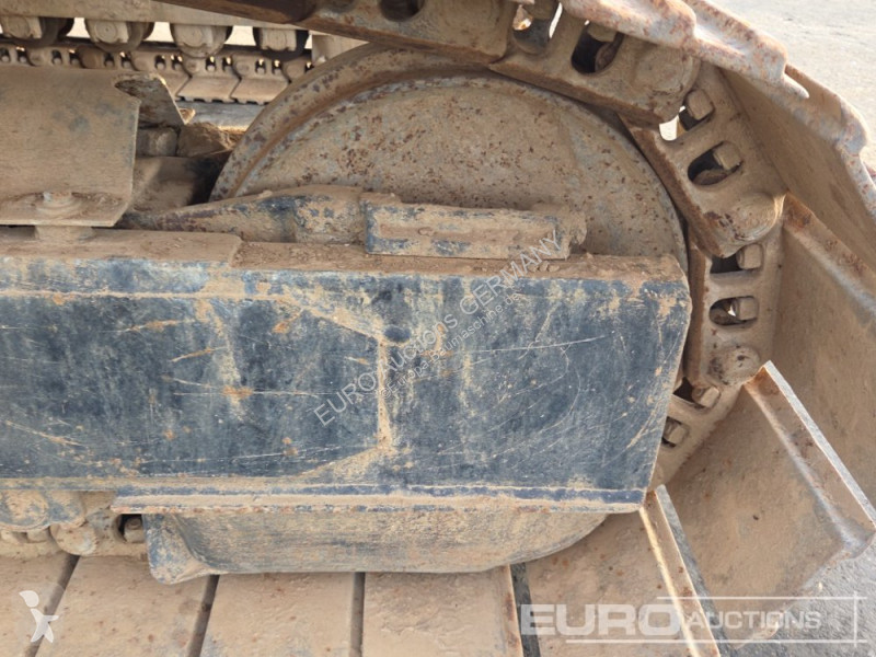 Багер Caterpillar 215C