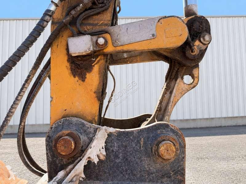 Багер Caterpillar MH