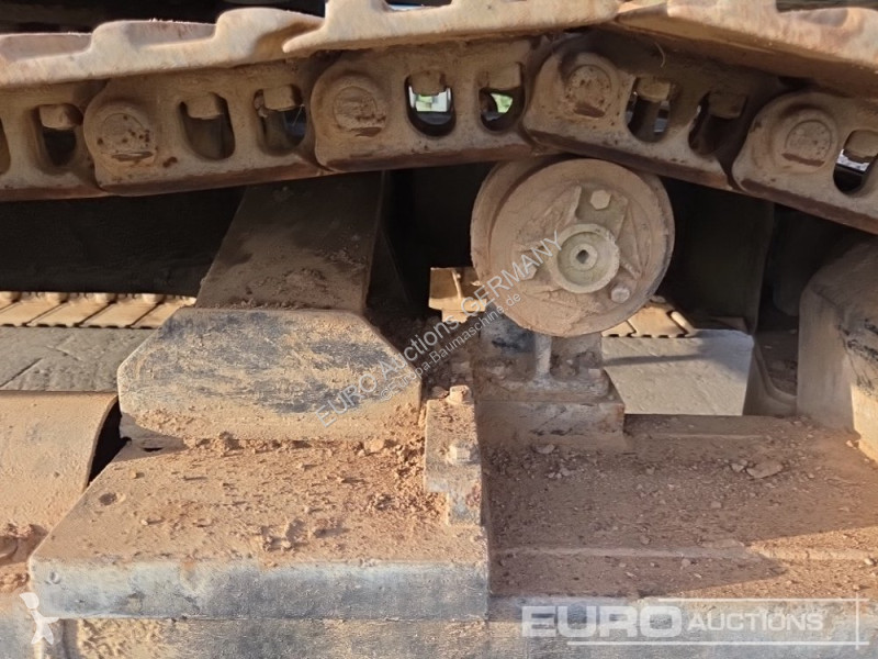 Багер Caterpillar 215C