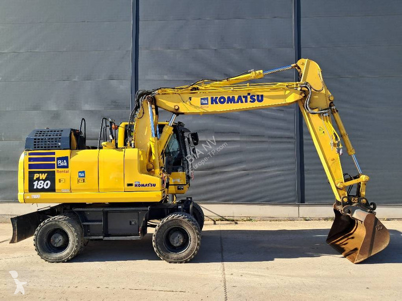 Багер Komatsu 11E0