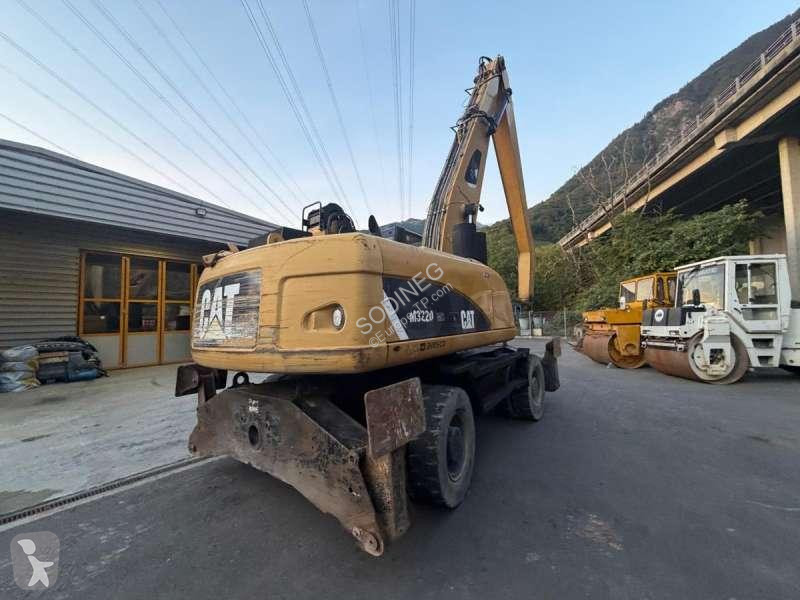Skovel Caterpillar DMH