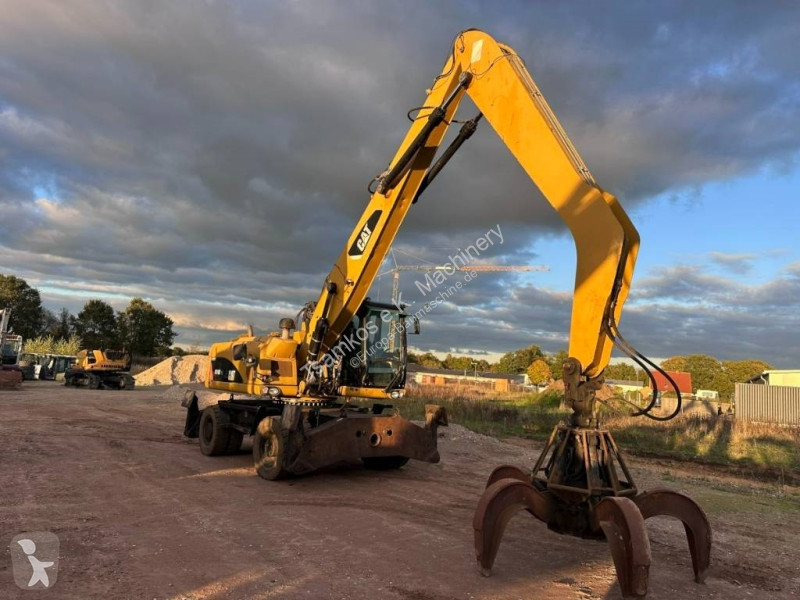 جرافة Caterpillar M 318 MH mit Greifer Kein...