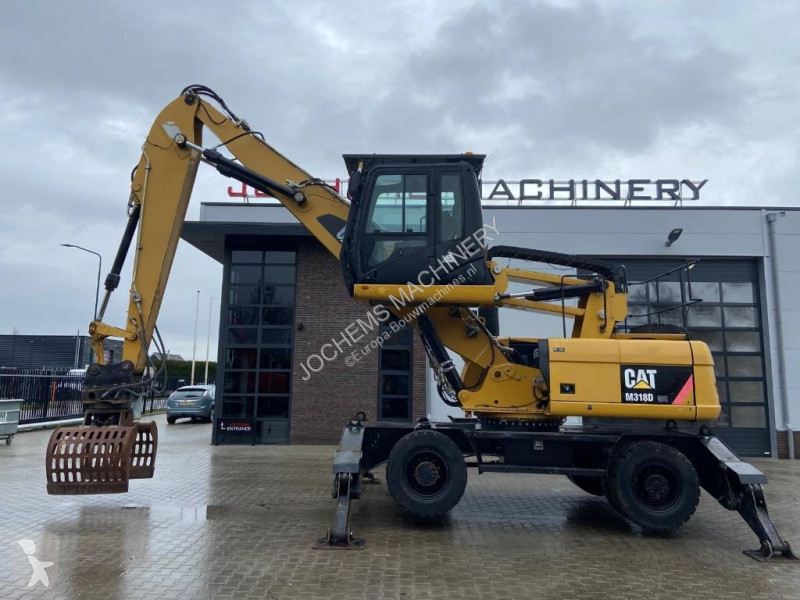 Escavatore Caterpillar M 318 D MH + GRAB