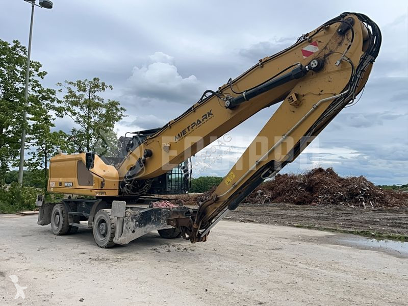 Rýpadlo Caterpillar MH3026