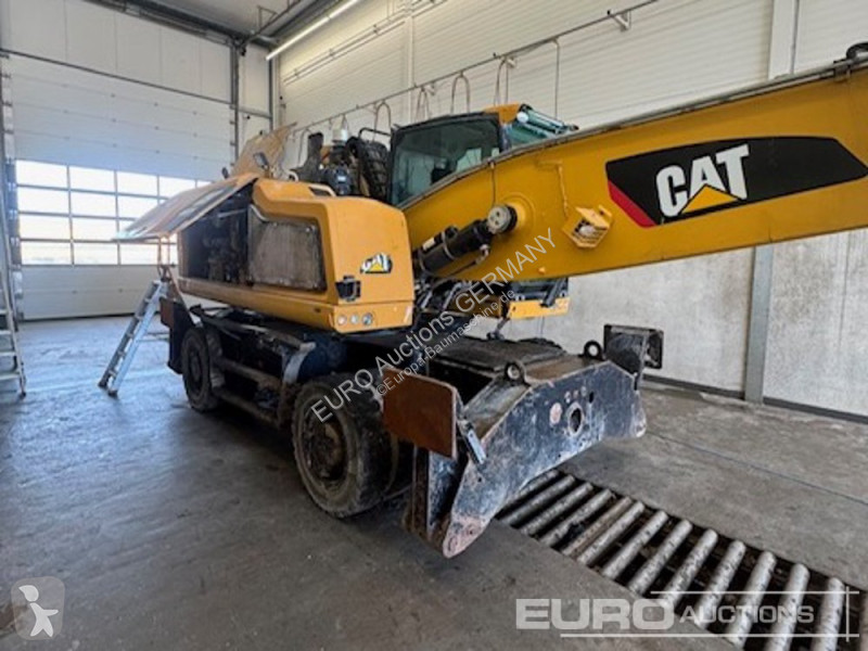 Багер Caterpillar MH3024