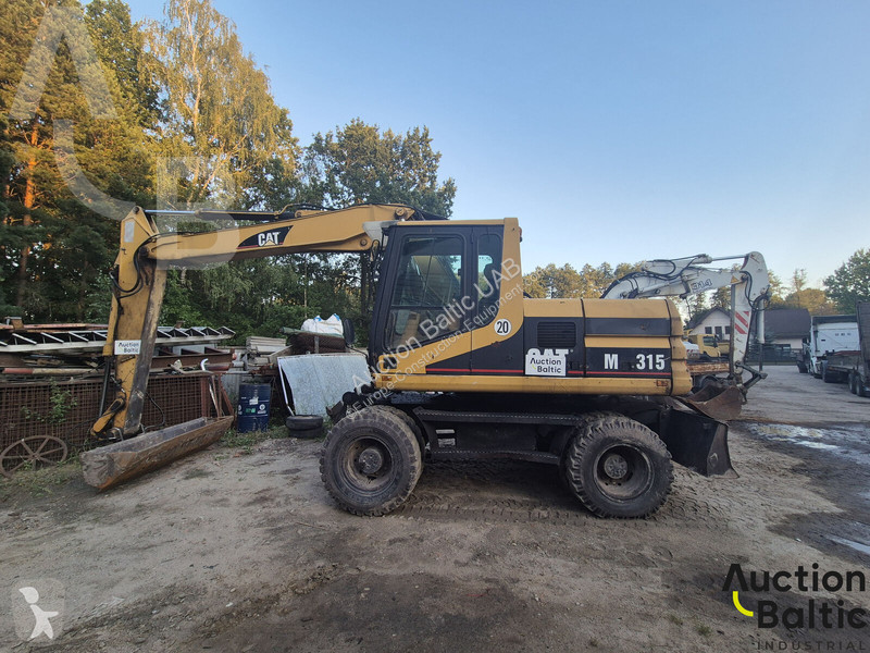 Екскаватор Caterpillar