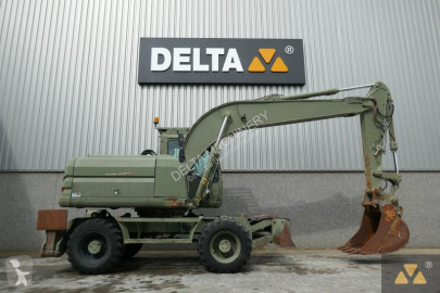 Graafmachine op banden Caterpillar