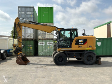 Graafmachine op banden Caterpillar