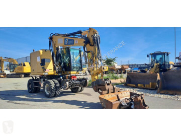 Колесен багер Caterpillar