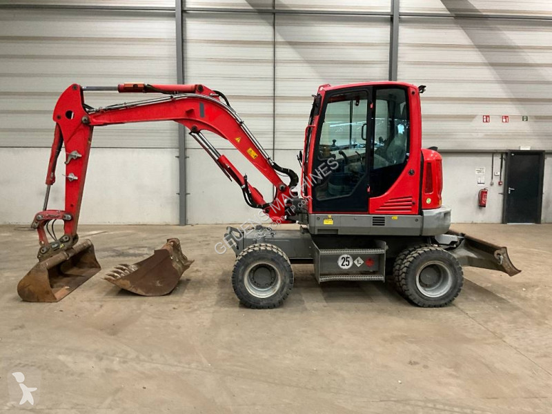 Багер Neuson EW 65