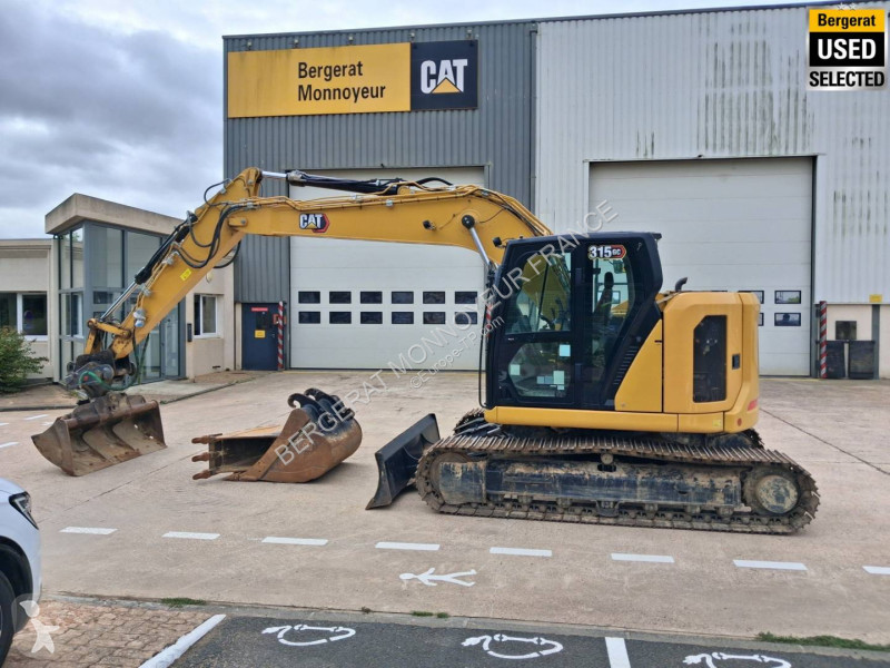 Багер Caterpillar GC