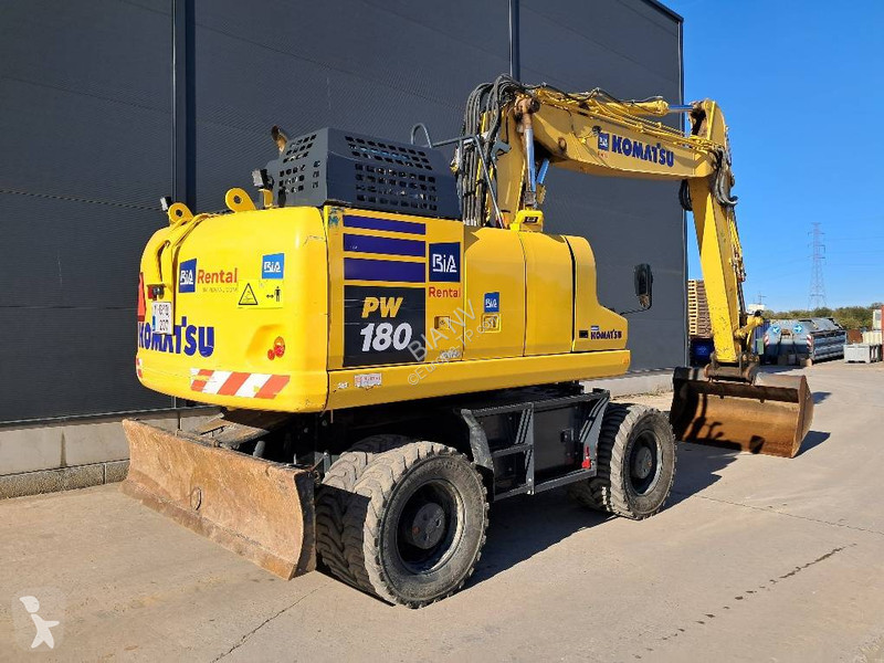 Багер Komatsu 11E0