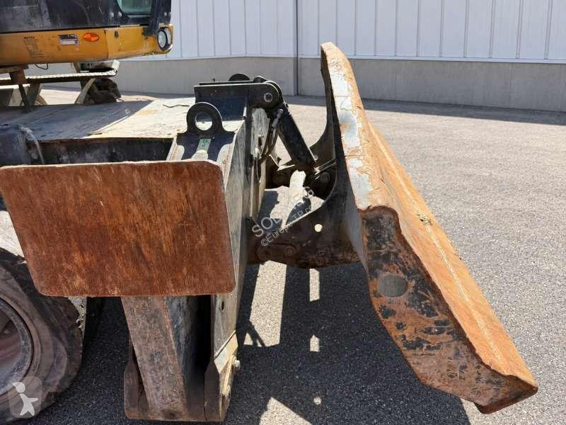 Багер Caterpillar MH